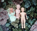 3 small dolls front blanket